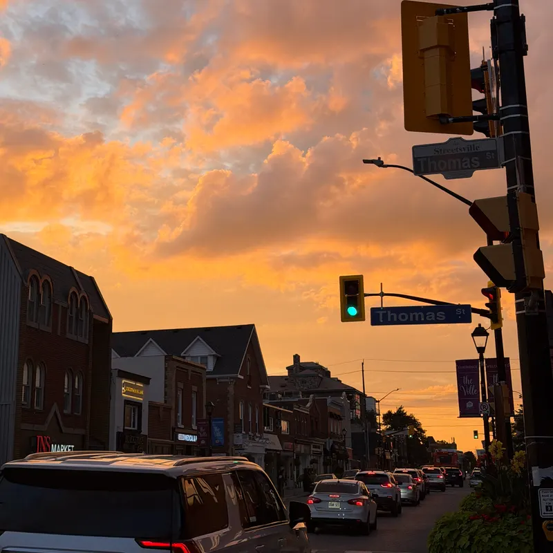 Orange sunset clouds over a small-town main street